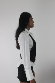 side view of black studded racerback cropped waistcoat