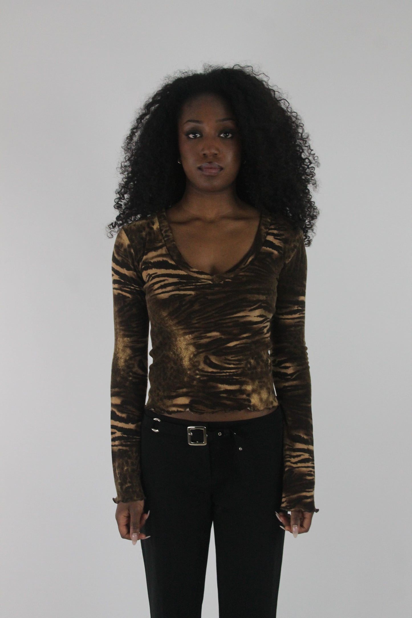 front view of brown zebra-print long-sleeve top