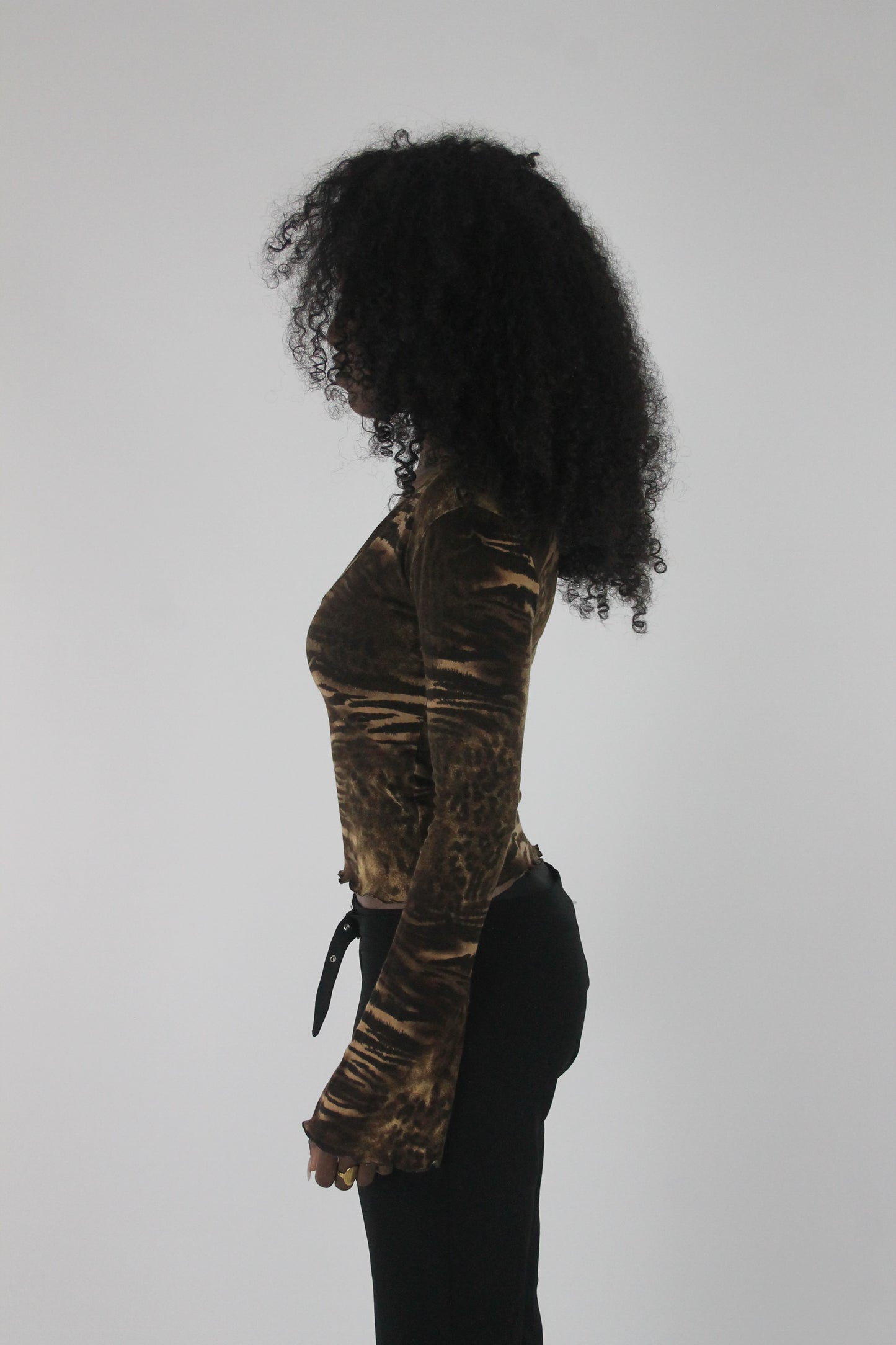 side view of brown zebra-print long-sleeve top