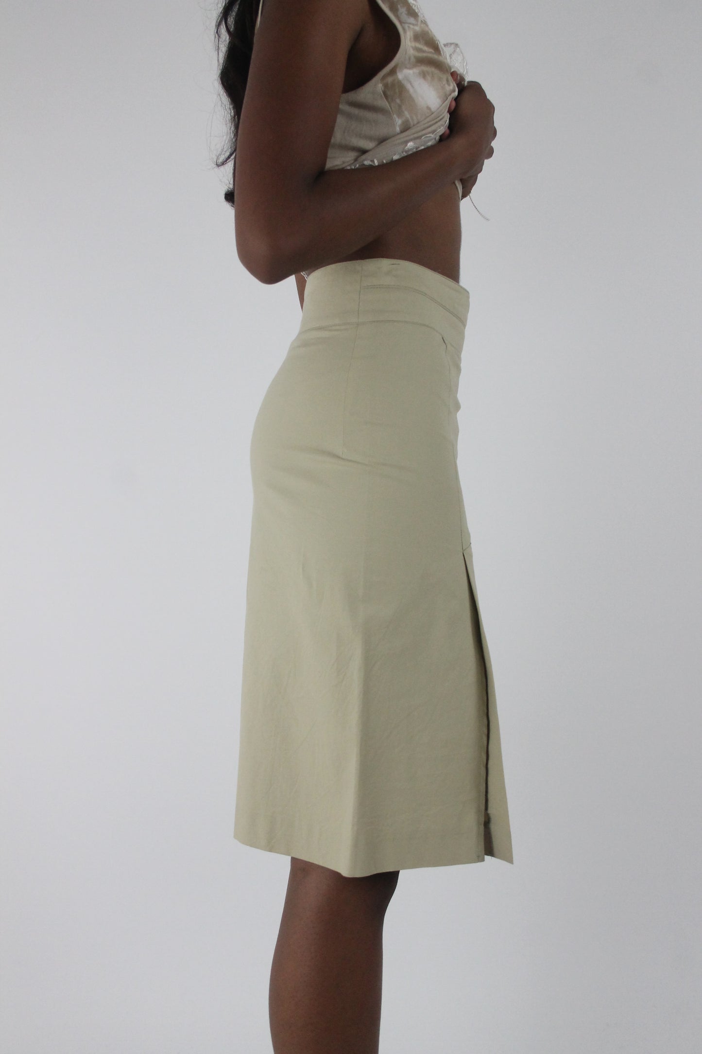side view of cream high-waisted side-slit midi skirt
