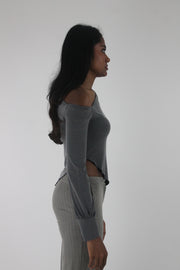 side view of grey asymmetric one-shoulder long-sleeve top