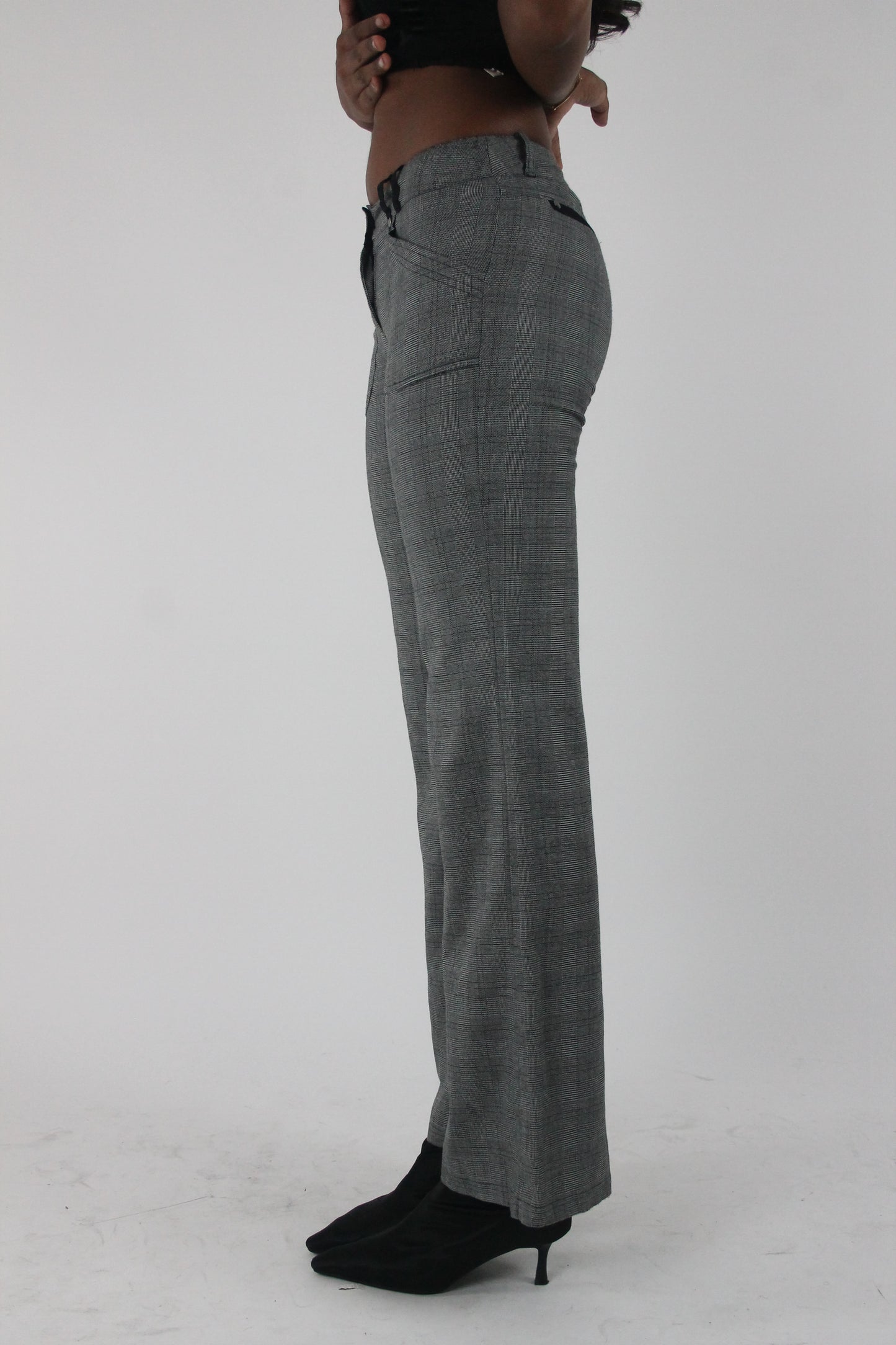 alternate-side view of grey check bootcut trousers