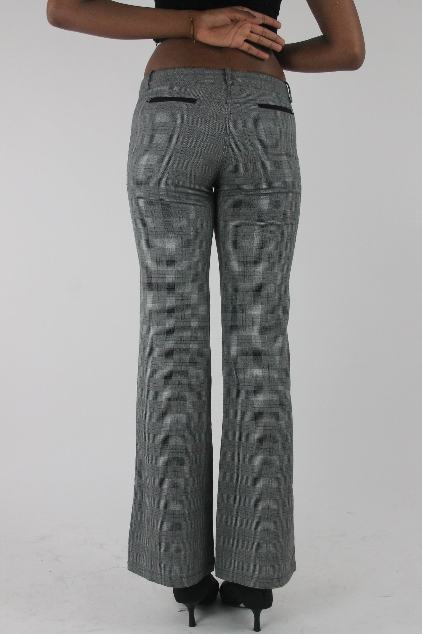 back view of grey check bootcut trousers