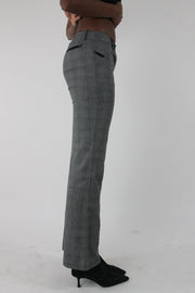 side view of grey check bootcut trousers