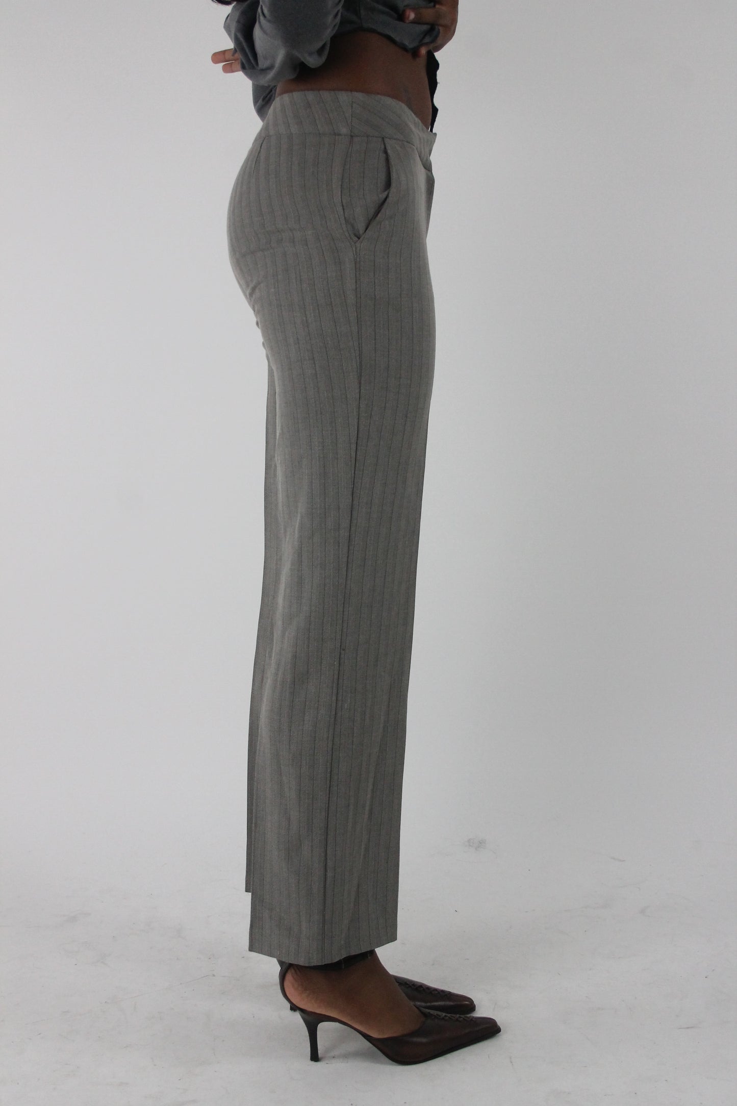 side view of grey pinstripe straight-leg trousers