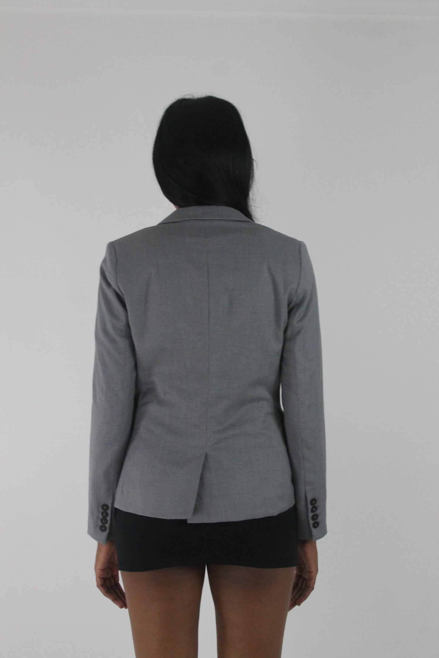 back view of grey single-button fitted blazer
