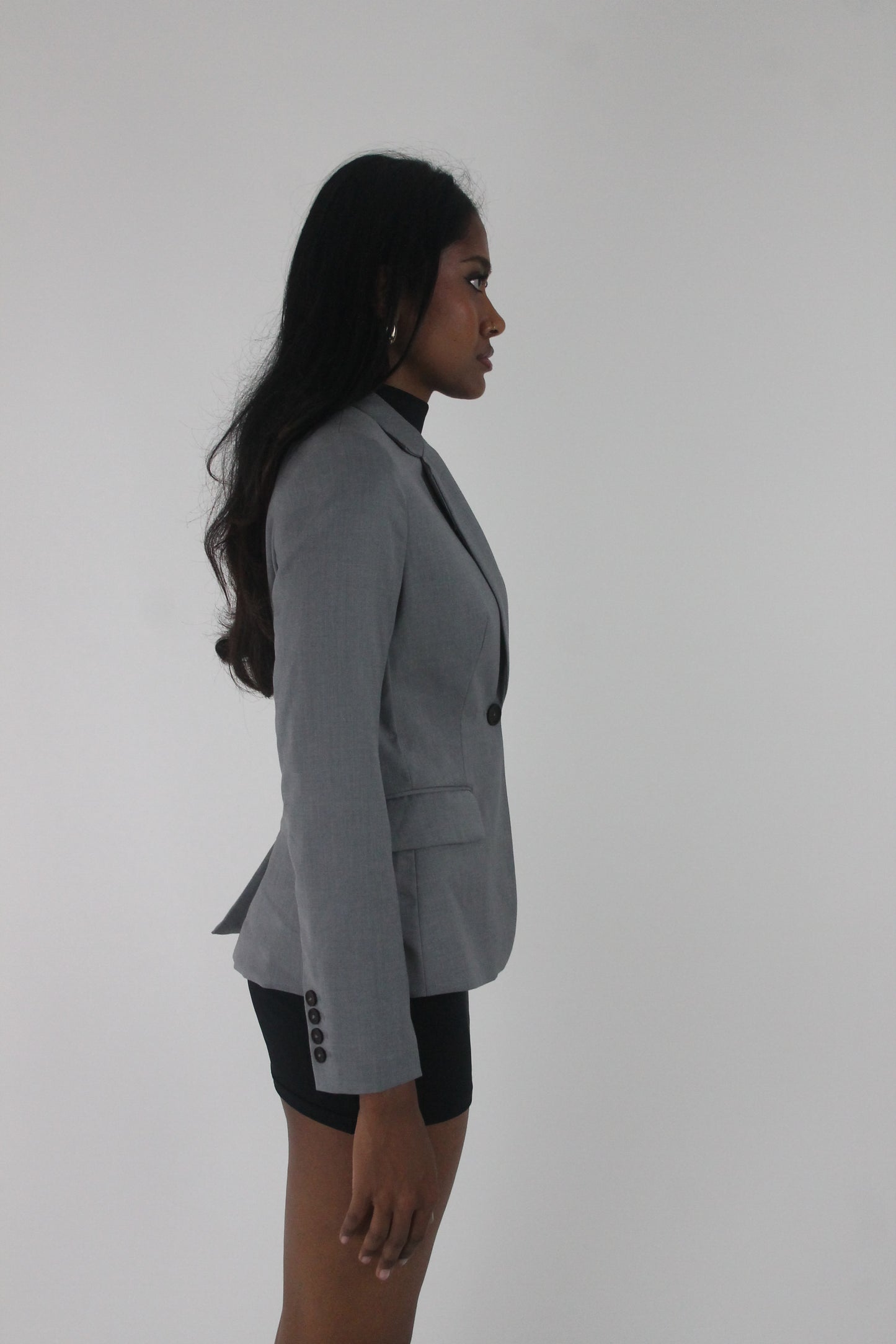 side view of grey single-button fitted blazer