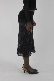 alternate-side view of pink purple and white swirl-print mesh midi skirt