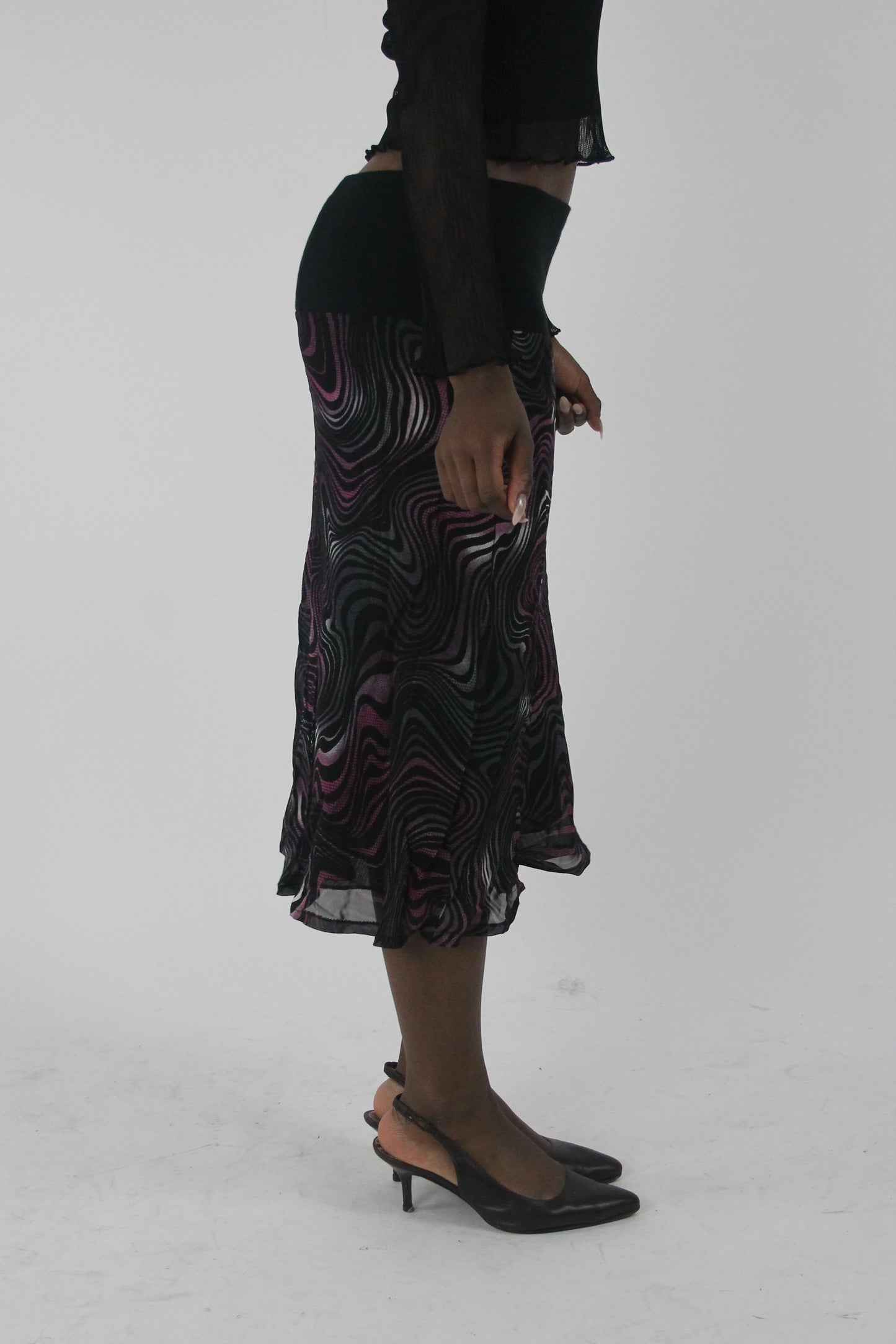 alternate-side view of pink purple and white swirl-print mesh midi skirt