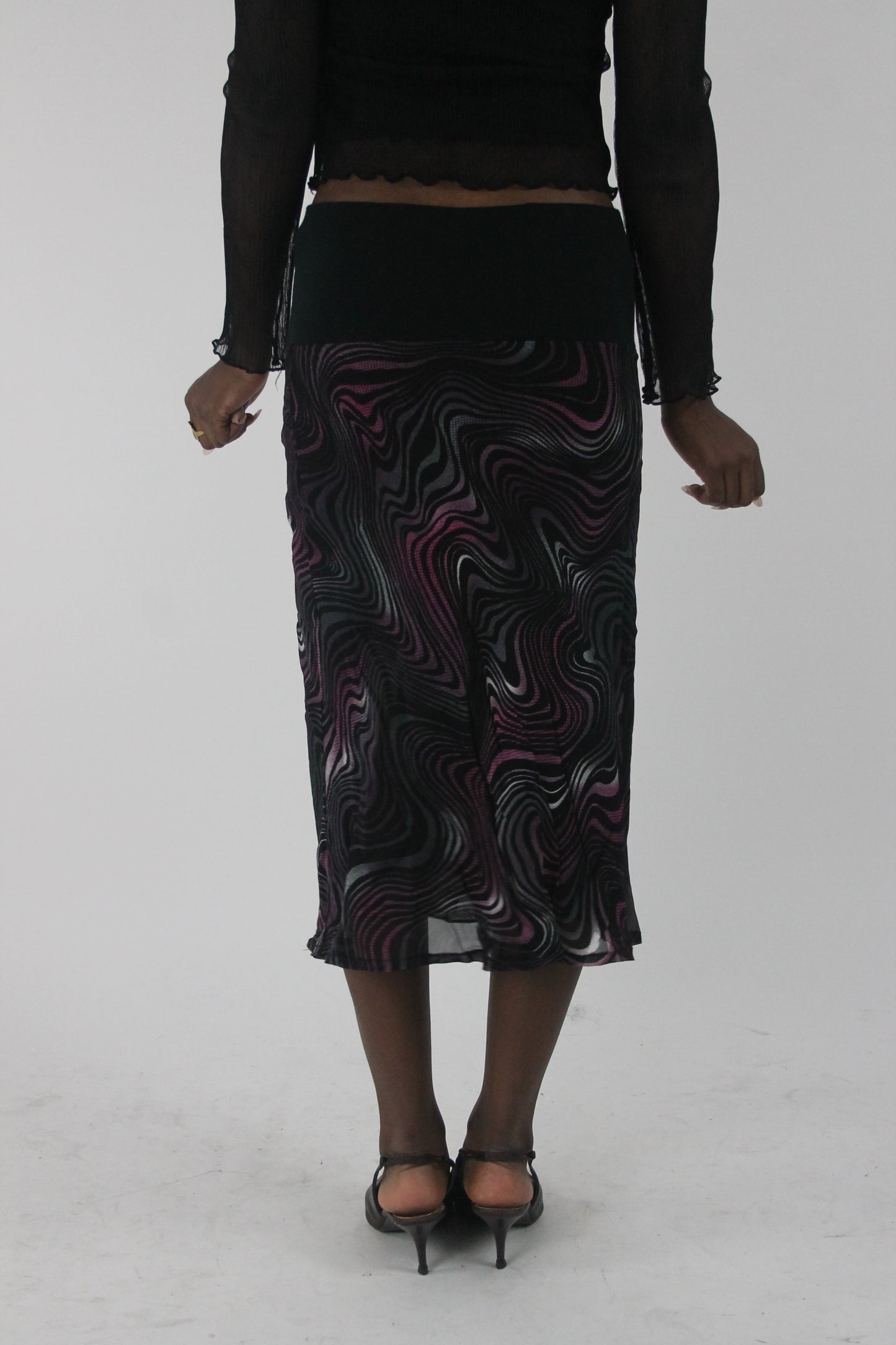 back view of pink purple and white swirl-print mesh midi skirt