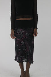 front view of pink purple and white swirl-print mesh midi skirt