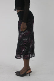 side view of pink purple and white swirl-print mesh midi skirt