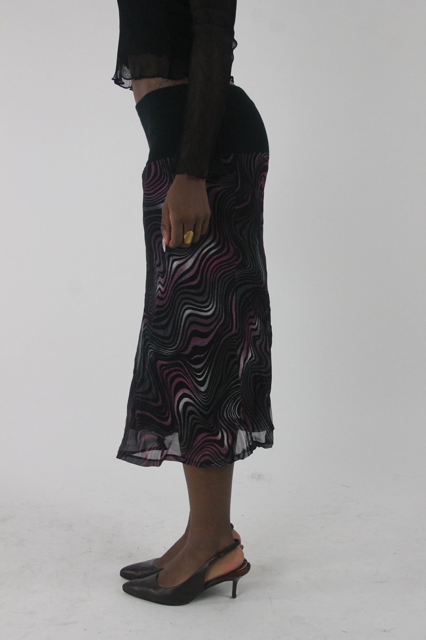 side view of pink purple and white swirl-print mesh midi skirt