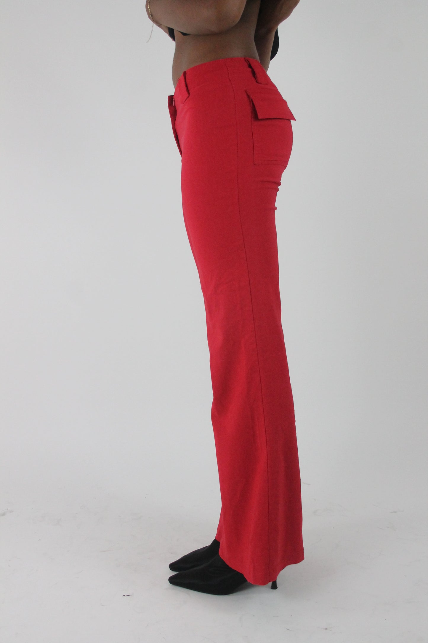 alternate-side view of red flap-pocket flared trousers