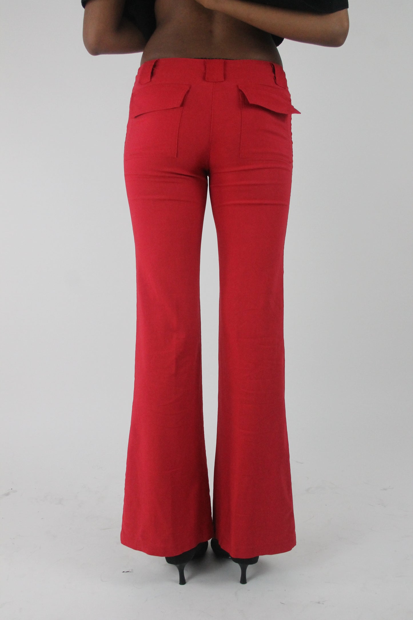 back view of red flap-pocket flared trousers