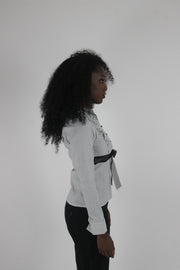 alternate-side view of white black-trim tie-front blouse