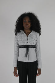 front view of white black-trim tie-front blouse