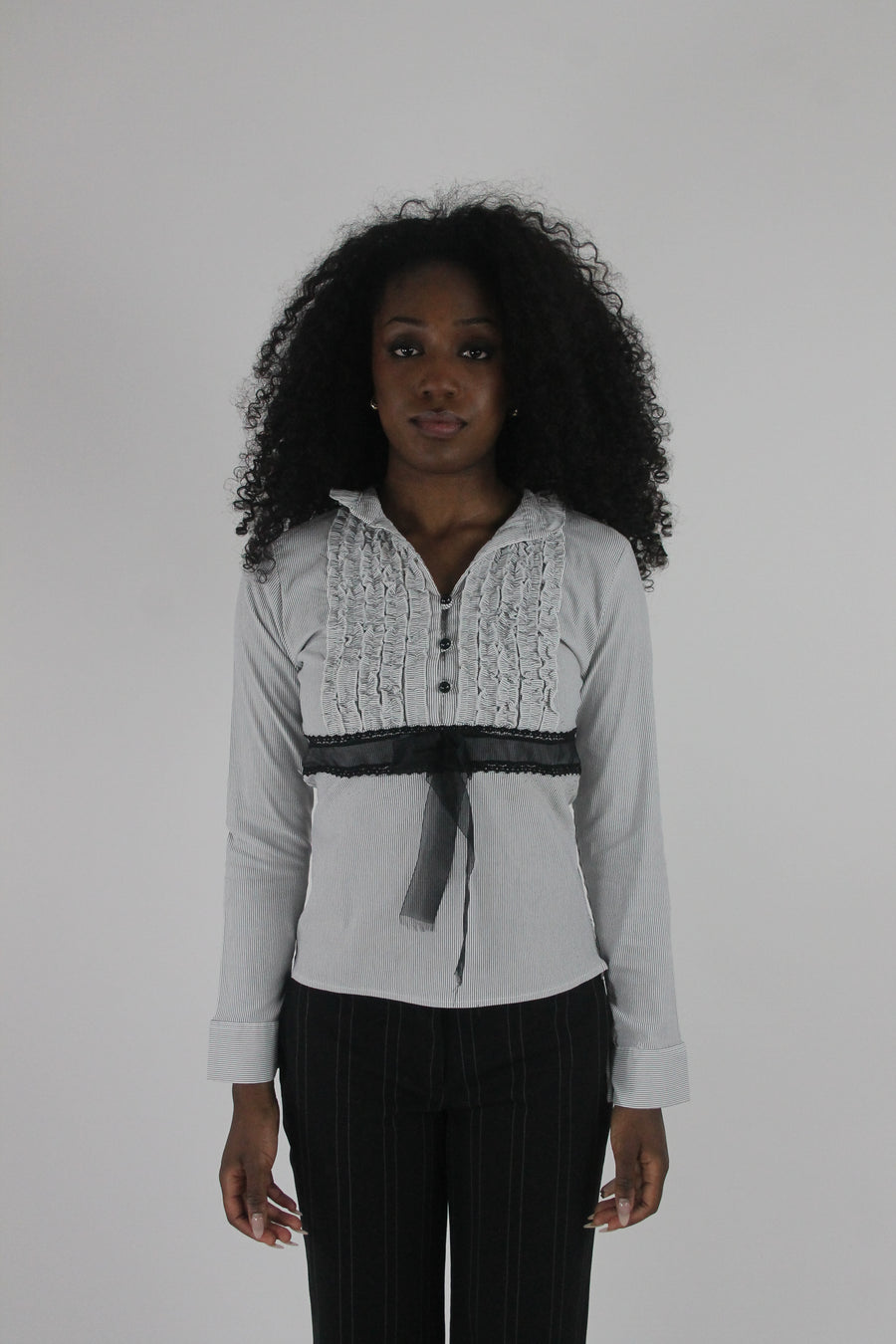 front view of white black-trim tie-front blouse