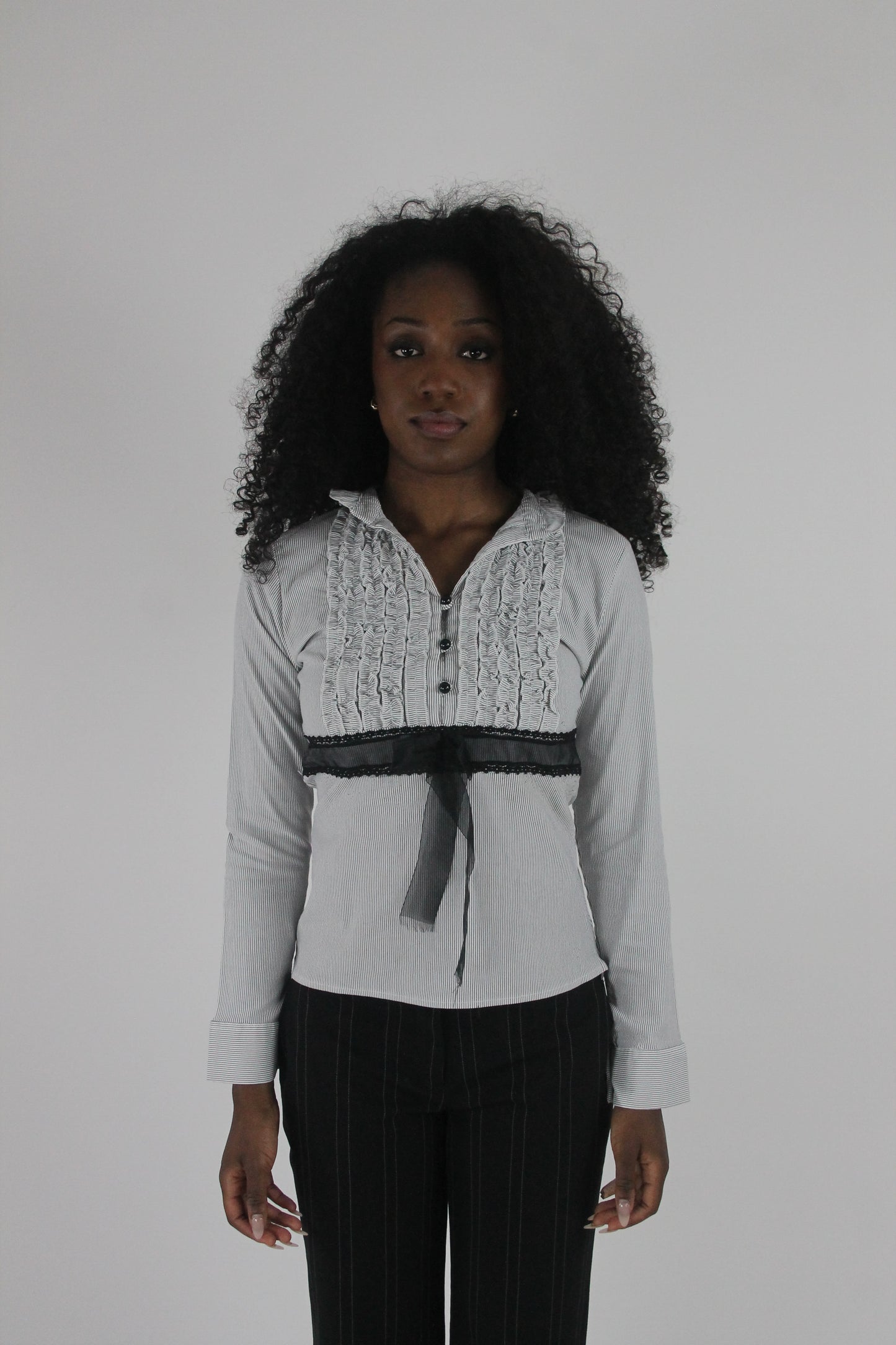 front view of white black-trim tie-front blouse