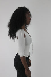 alternate-side view of white cold-shoulder tie-front top
