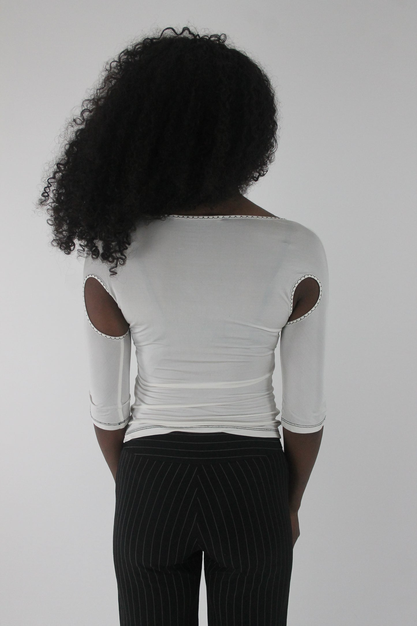 back view of white cold-shoulder tie-front top