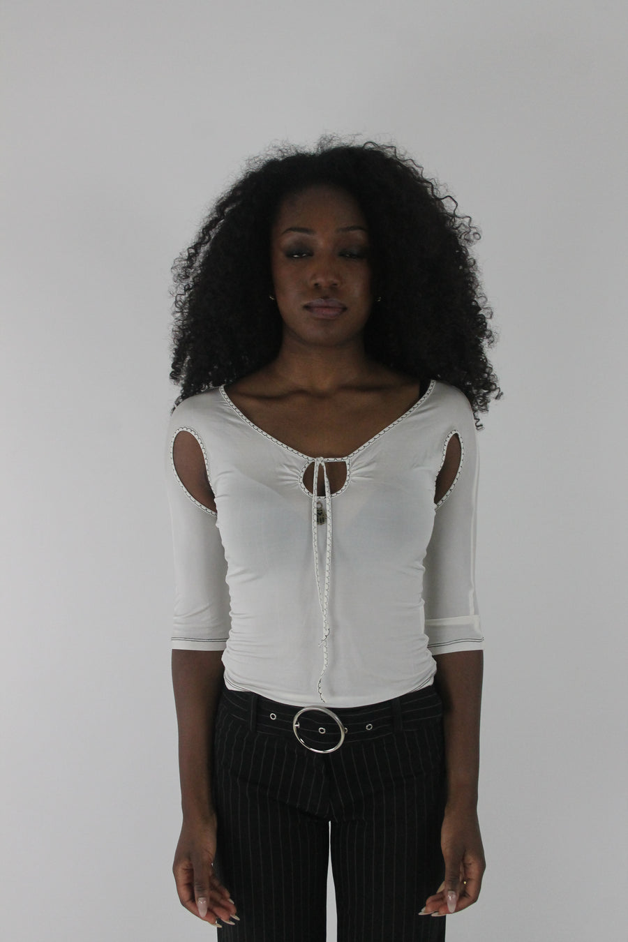 front view of white cold-shoulder tie-front top