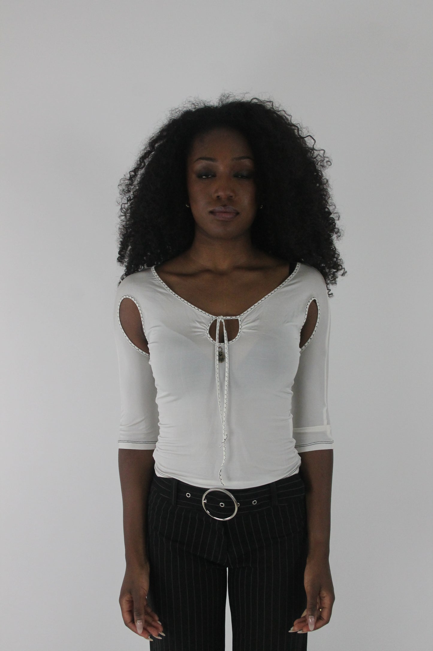 front view of white cold-shoulder tie-front top