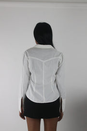 back view of white fitted long-sleeve button-up shirt