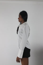 detail view of white fitted long-sleeve button-up shirt