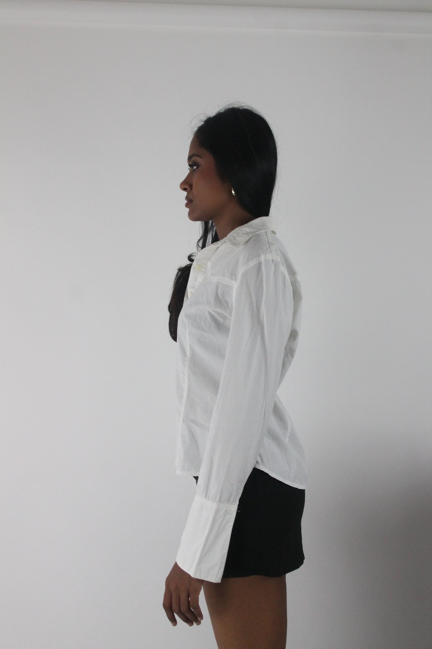 detail view of white fitted long-sleeve button-up shirt