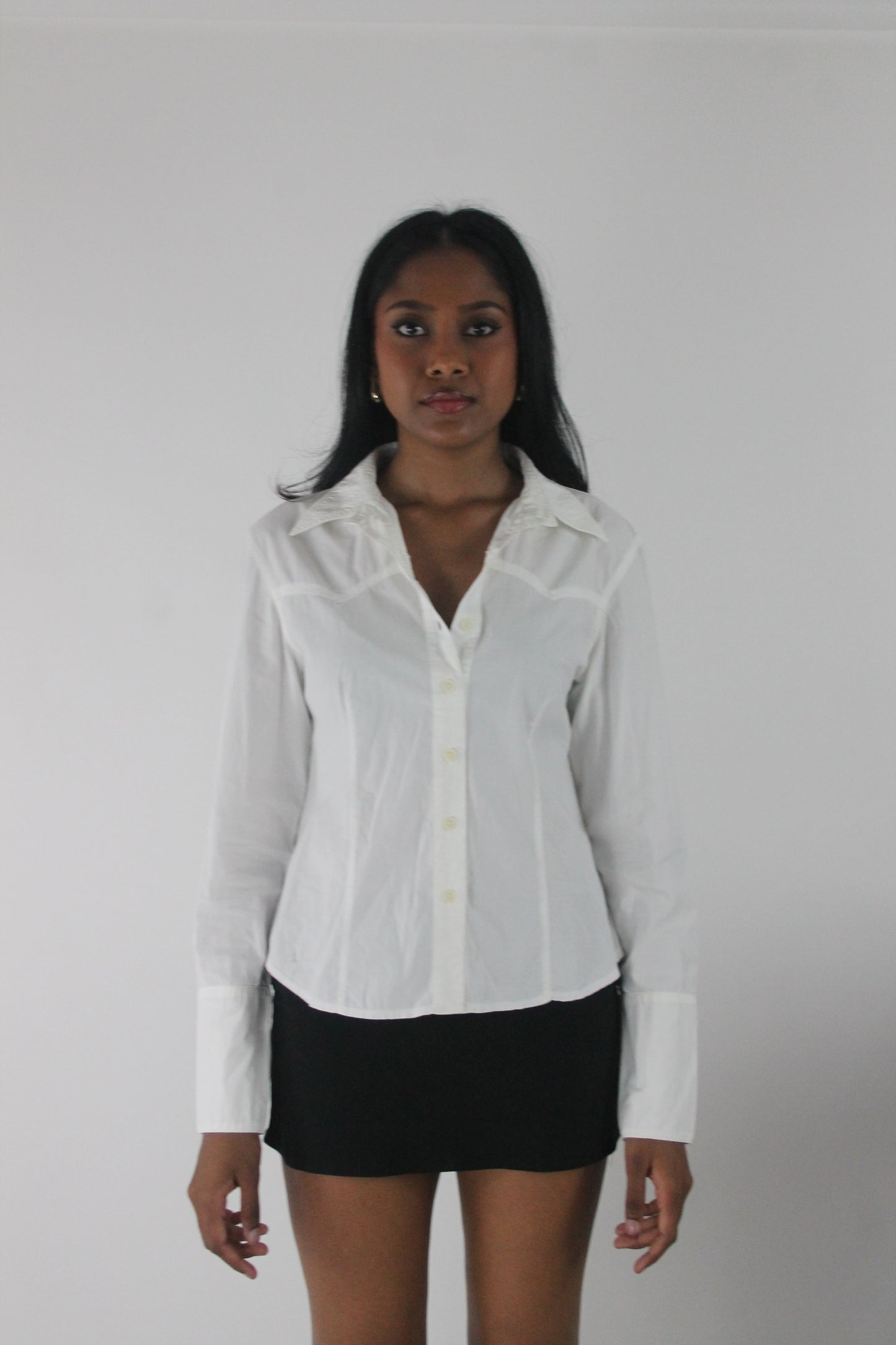 side view of white fitted long-sleeve button-up shirt
