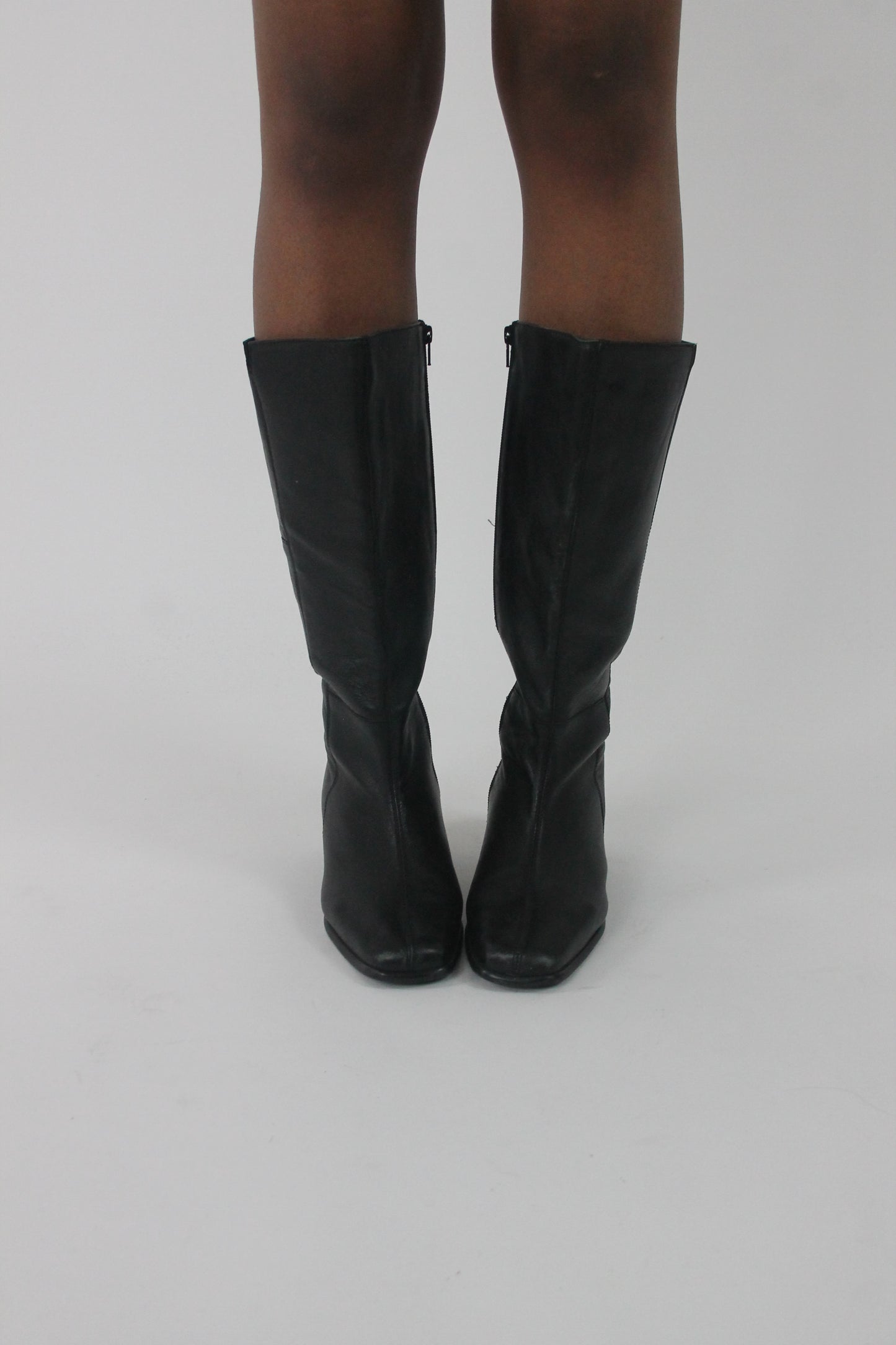 front view of black knee-high block-heel boots