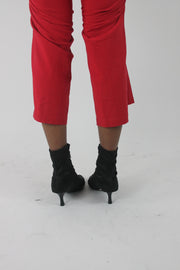 back view of black pointed-toe stiletto ankle boots