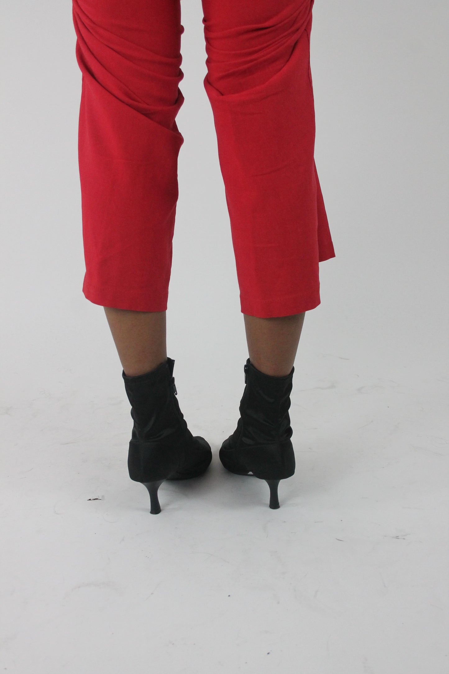 back view of black pointed-toe stiletto ankle boots