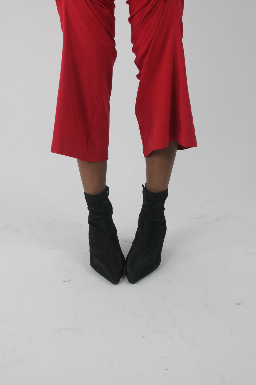 front view of black pointed-toe stiletto ankle boots