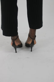 alternate-side view of brown pointed-toe slingback kitten heels