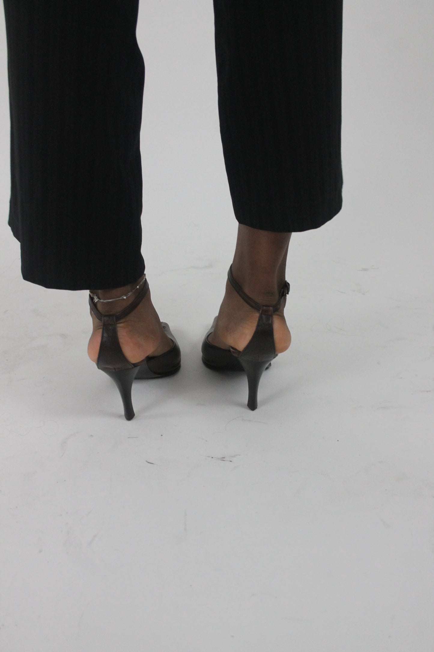 alternate-side view of brown pointed-toe slingback kitten heels