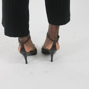 alternate-side view of brown pointed-toe slingback kitten heels