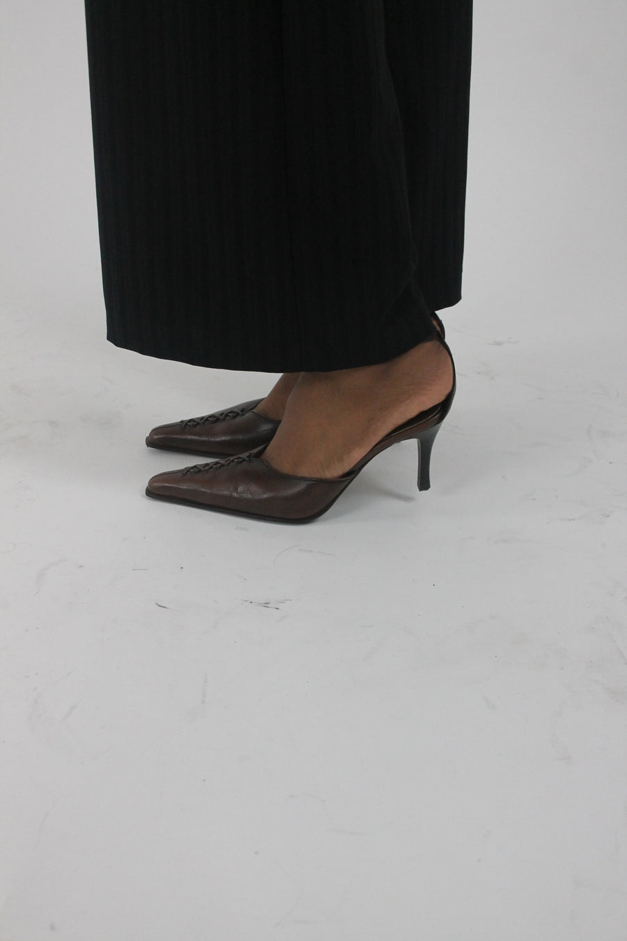 front view of brown pointed-toe slingback kitten heels