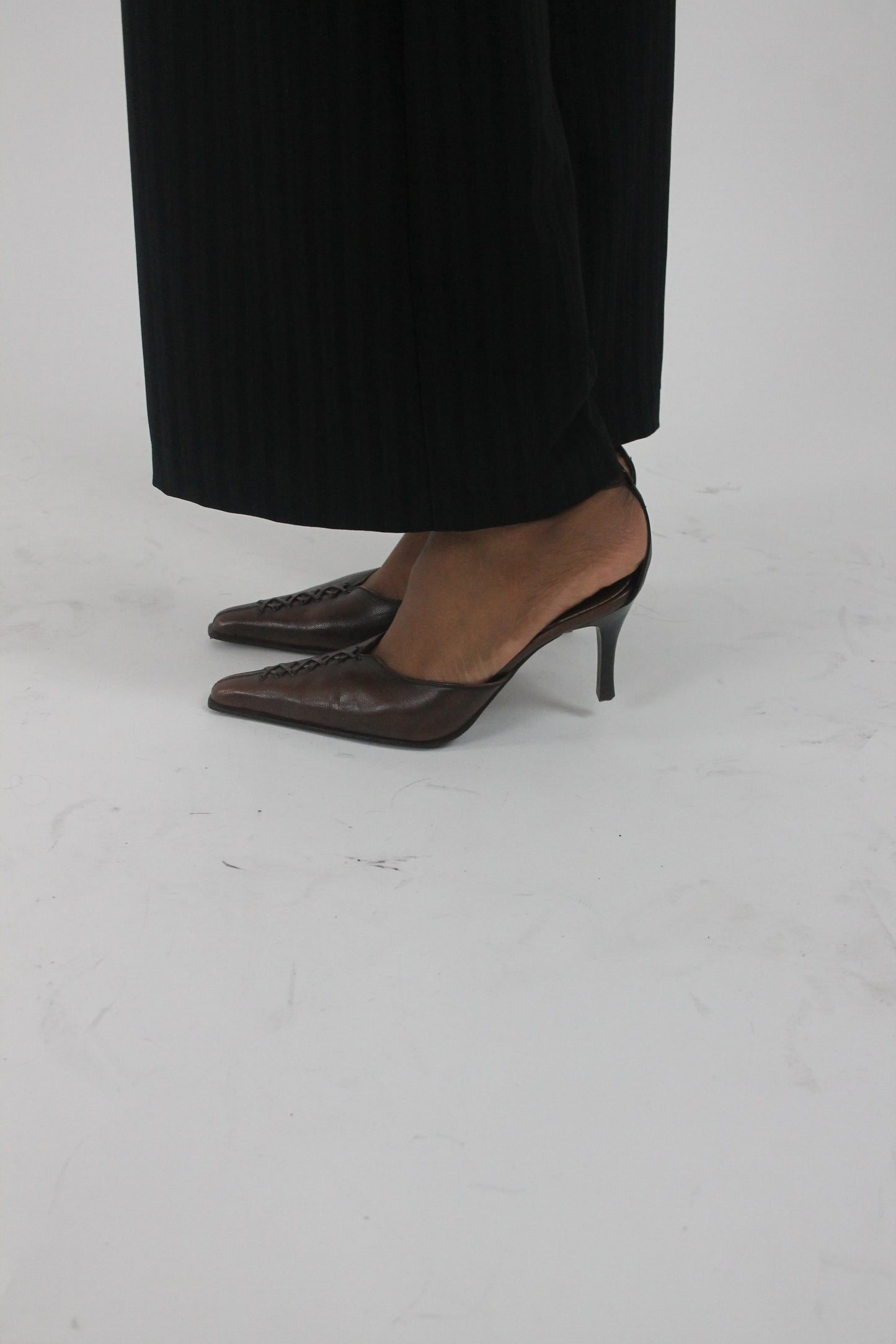 front view of brown pointed-toe slingback kitten heels