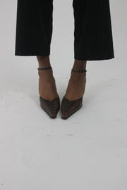 side view of brown pointed-toe slingback kitten heels
