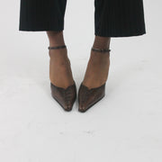 side view of brown pointed-toe slingback kitten heels