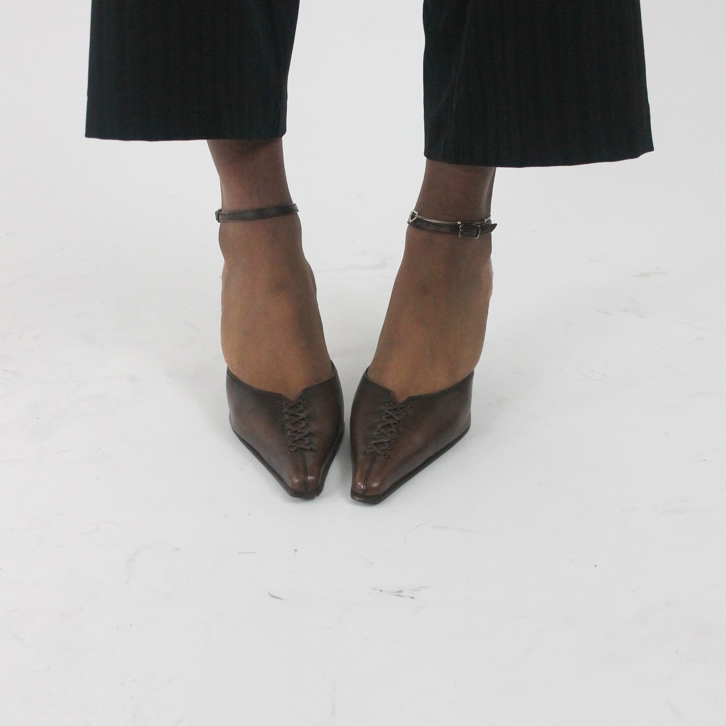 side view of brown pointed-toe slingback kitten heels