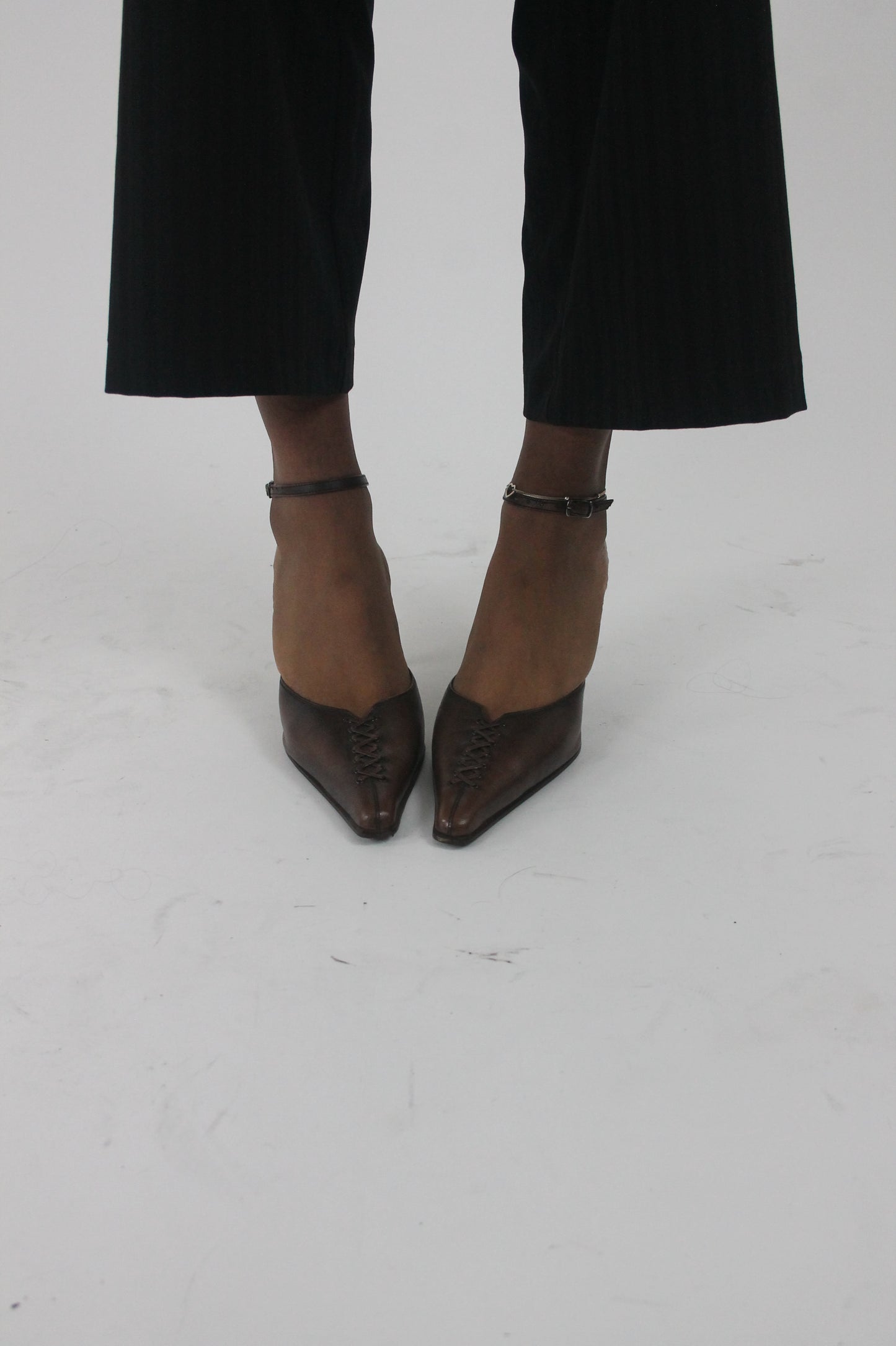 side view of brown pointed-toe slingback kitten heels