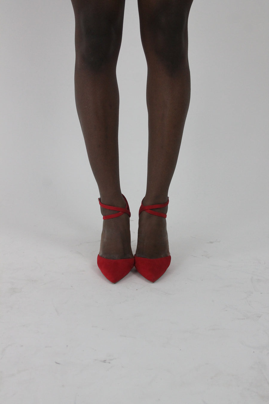 front view of red pointed-toe strappy stiletto heels