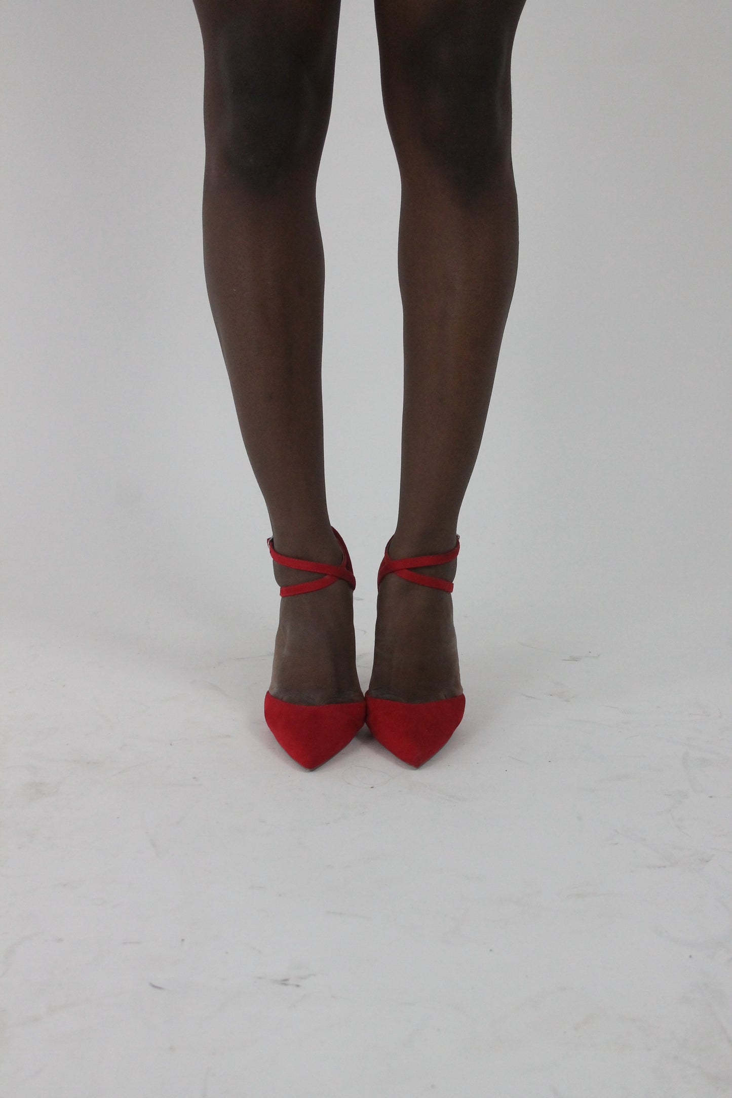 front view of red pointed-toe strappy stiletto heels