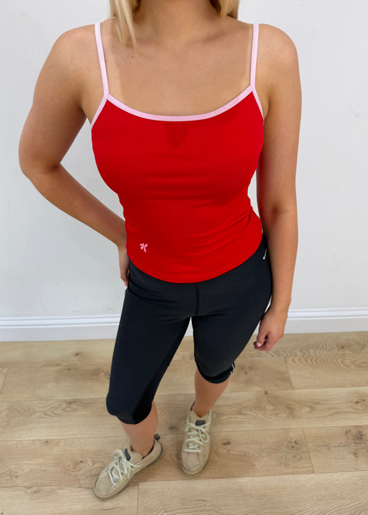 small red cami top with white detailing