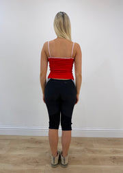 small red cami top with white detailing