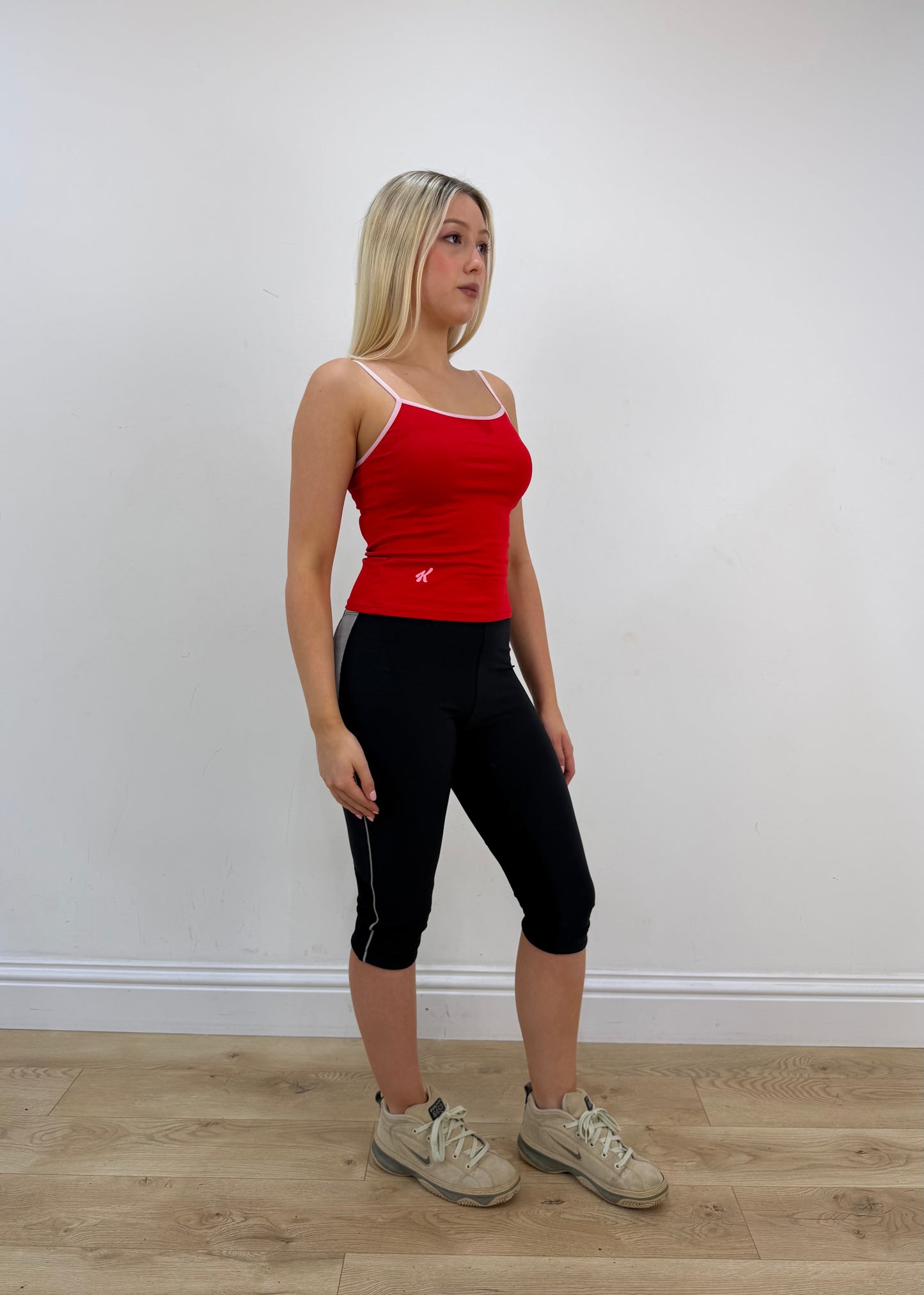 small red cami top with white detailing