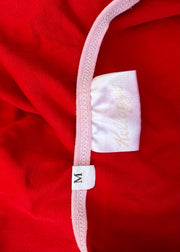 small red cami top with white detailing